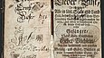 Open pages of an old, damaged book