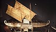 Wooden boat with two rectangular sails