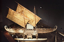 Wooden boat with two rectangular sails