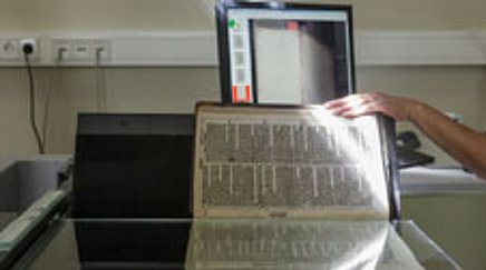 Printed work being digitized with a scanner 