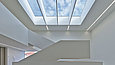 View of the white stairwell with skylight