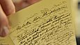 Hand holding a handwritten letter
