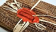 Book tied with raffia and sealed with red wax