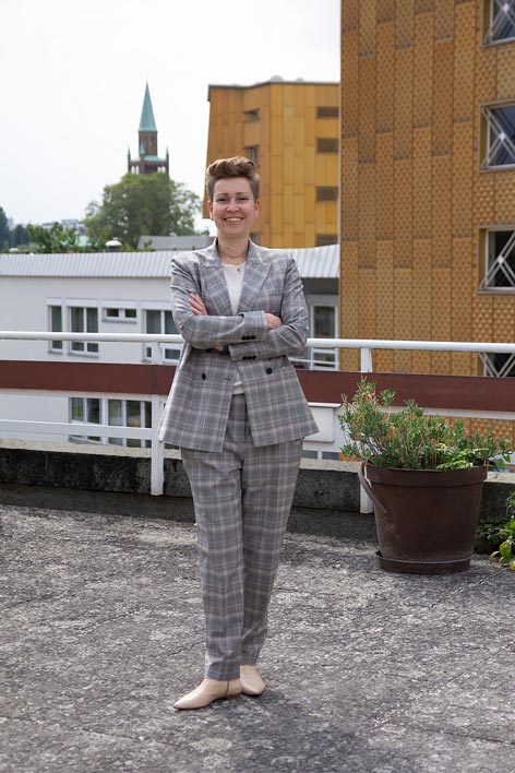 Rebecca Wolf A woman in a suit poses for a picture