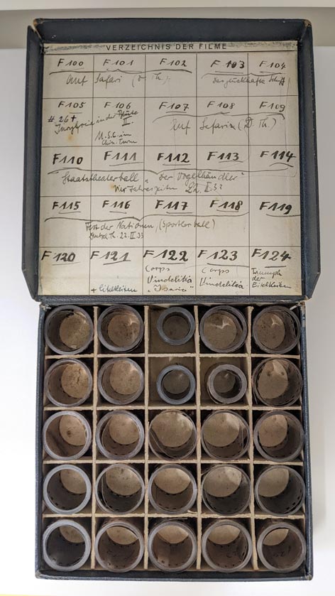 Box of rolled historical film reels