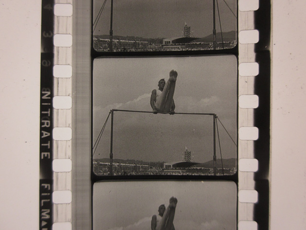 Stuttgarter Turnfest, 1933 Negative of a photograph showing a man performing gymnastics on the horizontal bar