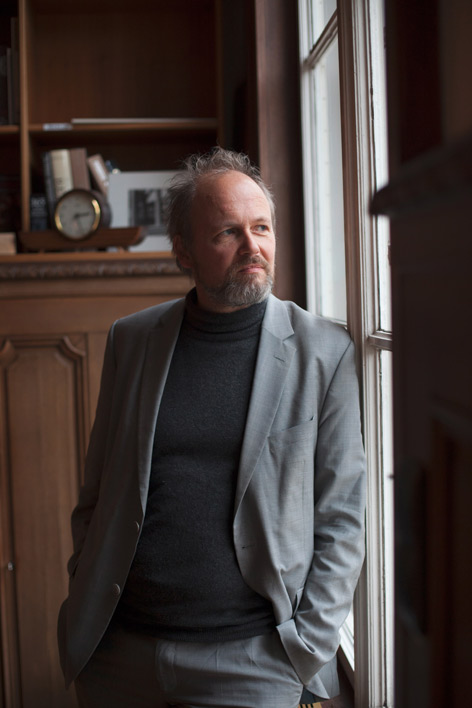 A man standing by a window