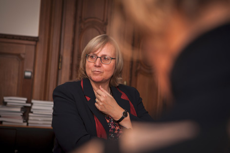 A woman at a round table