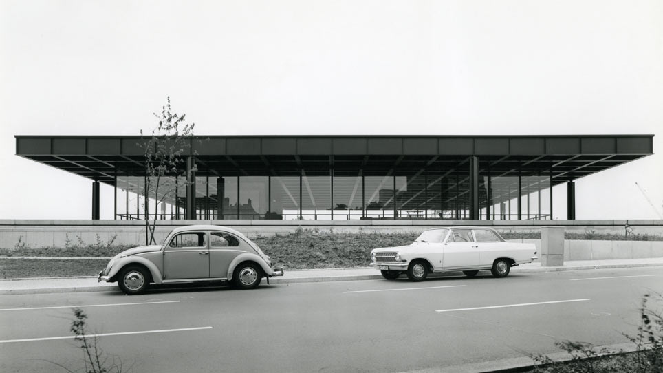 View of the Neue Nationalgalerie with cars on the street in the foreground