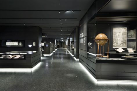 View of an exhibition with multiple showcases
