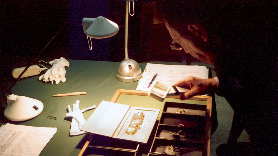 The director of the Museum für Vor- und Frühgeschichte examining objects in storage in Russia