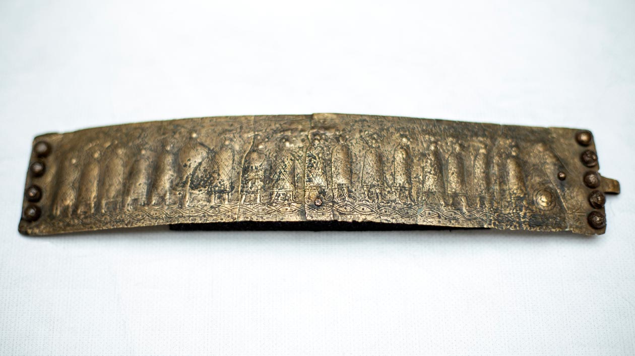 A bronze belt plate with embossed, figural decoration from the Stična find complex (Slovenia