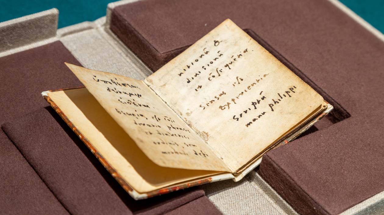 Family album of pastor Winsheim with entry by Philipp Melanchthon Opened historical book with handwritten entries