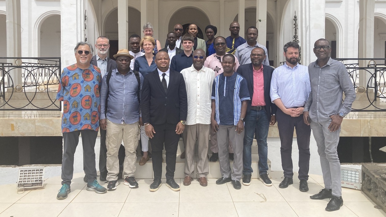 Scientists are standing together in a group 